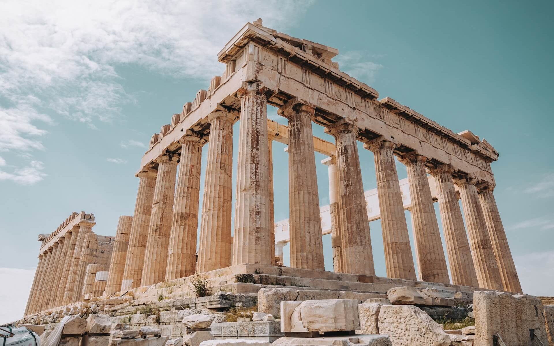 Standing atop the Acropolis of Athens, where iconic ancient structures like the Parthenon and the Erechtheion still command attention.